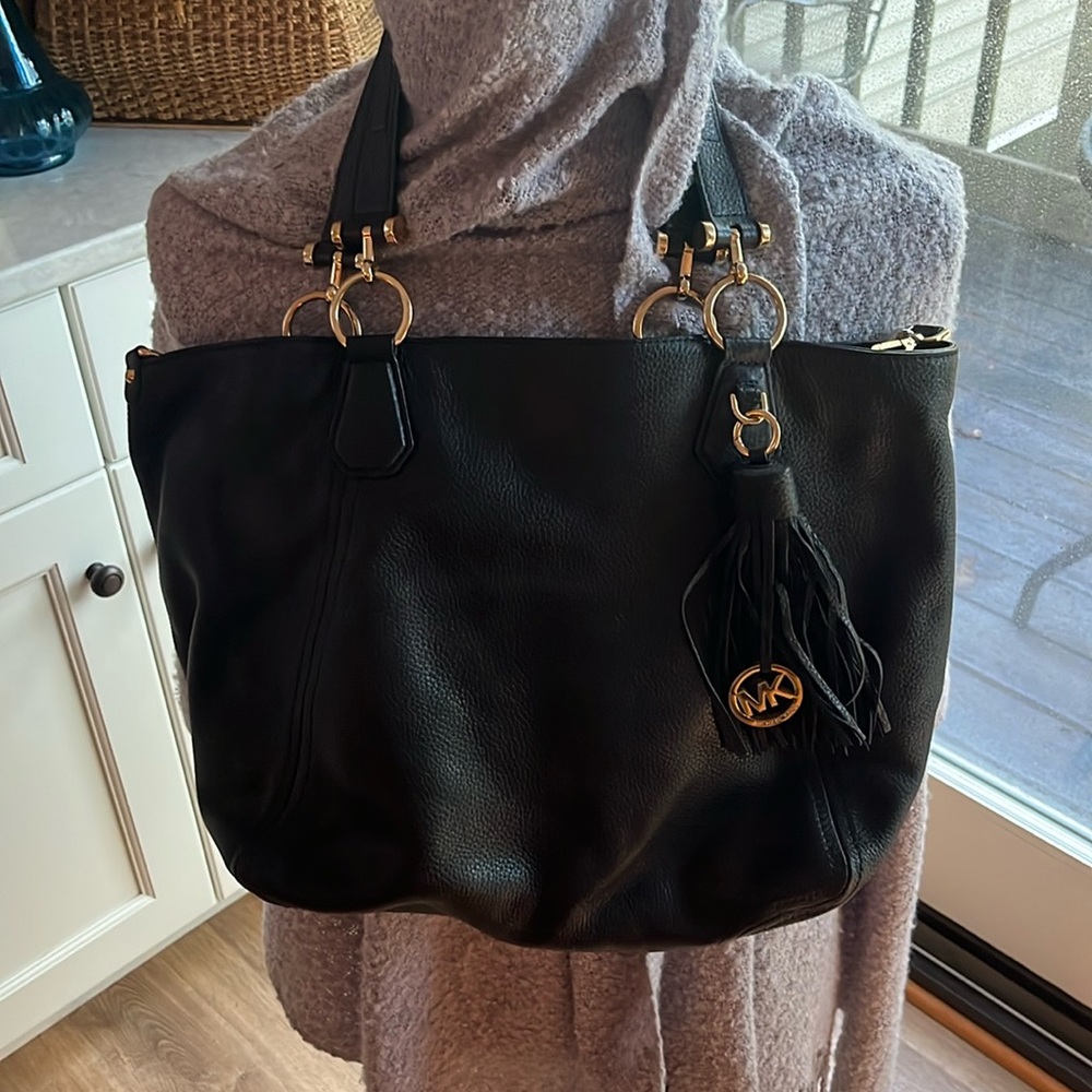 Michael Kors Black tote  Purse pocketbook with tassel.  As new condition